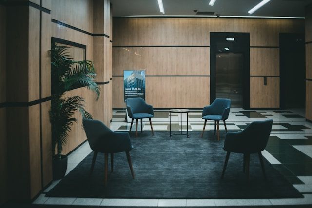 A room with four empty chairs representing a meeting isn't needed.